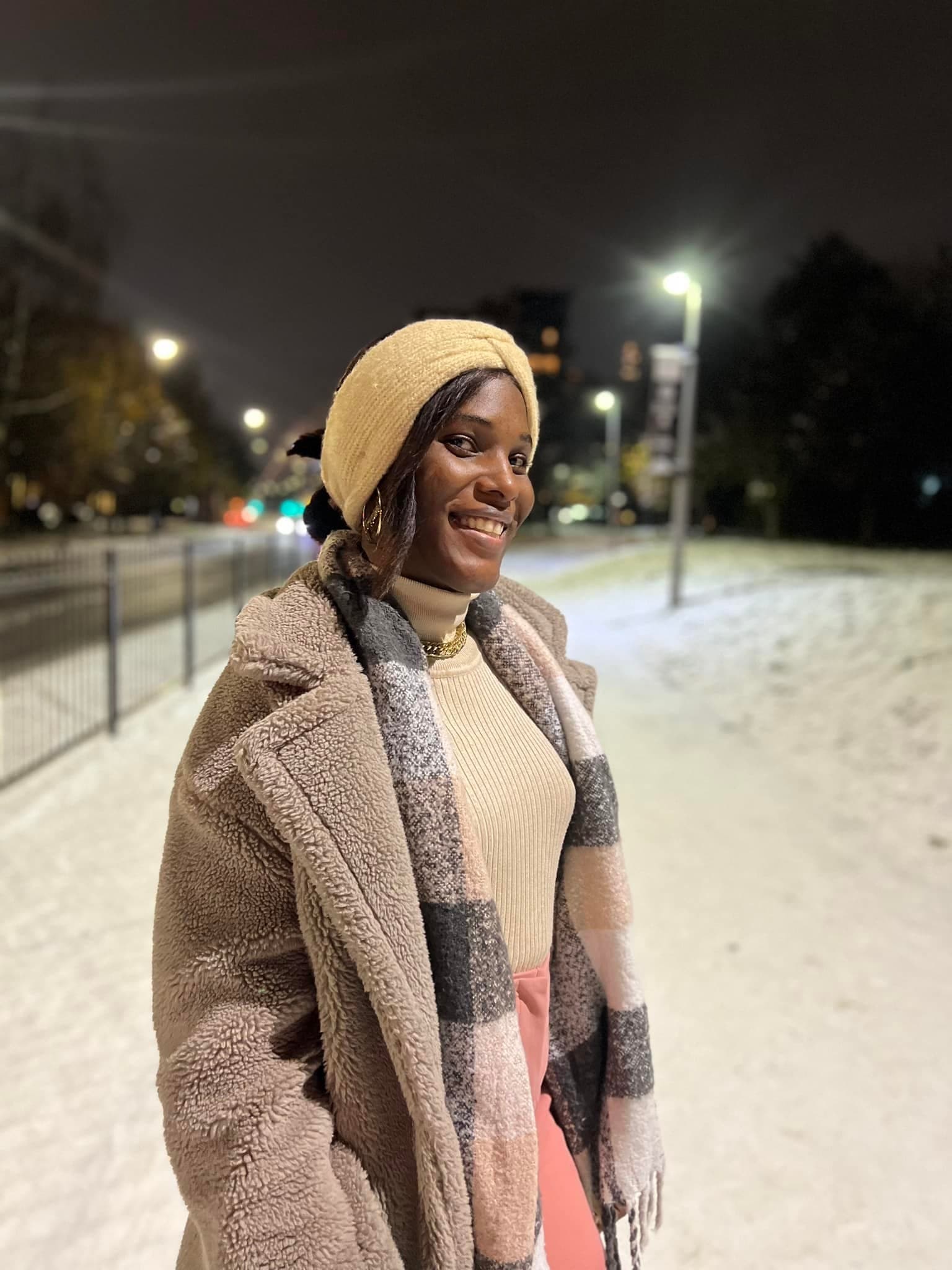 Shenita standing in the snow in London